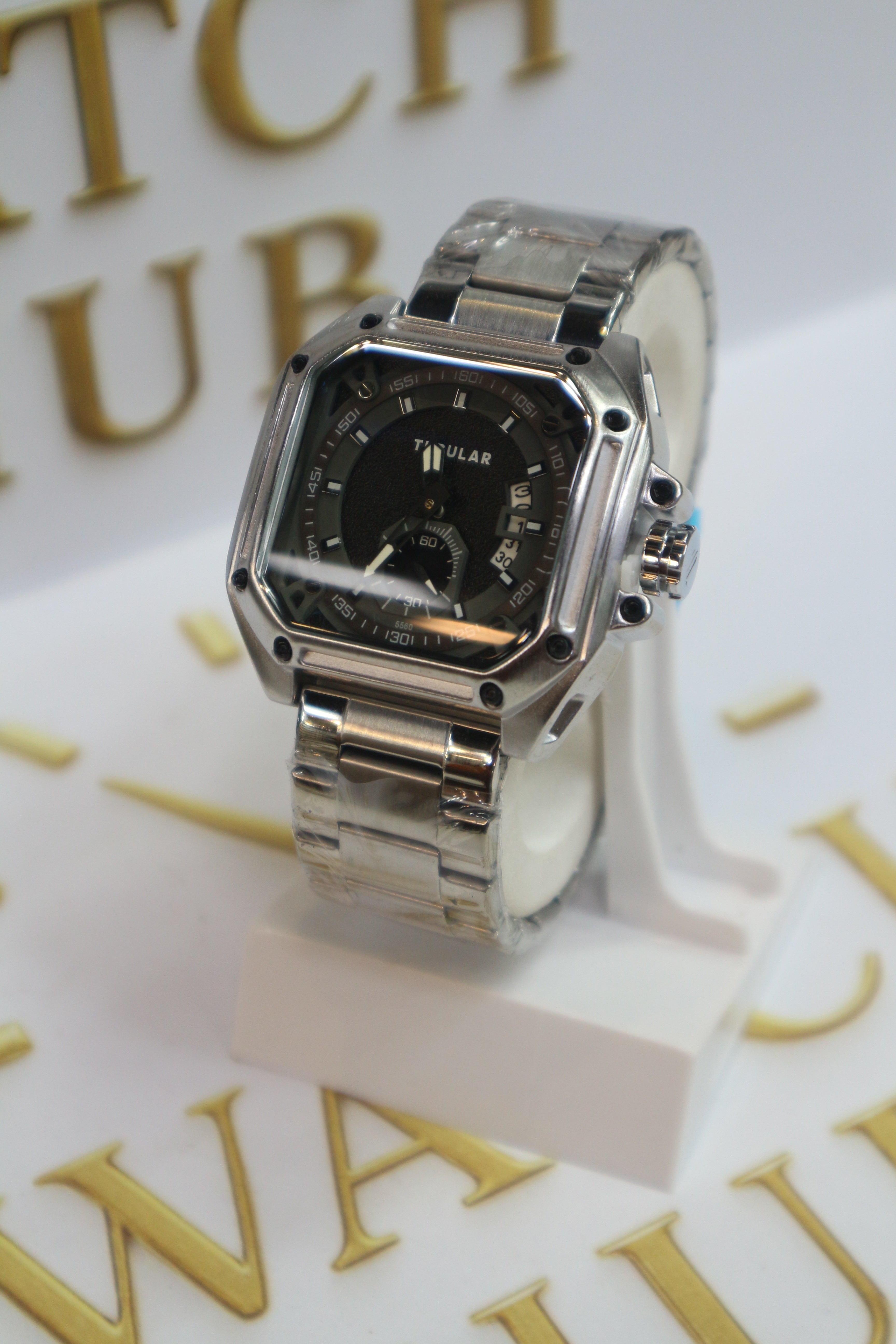 TUBULAR Appears to be Model Matte Black Textured Center with Glossy Silver Hour Markers